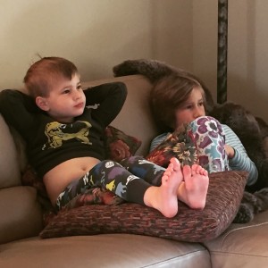 kids watching tv with belly out